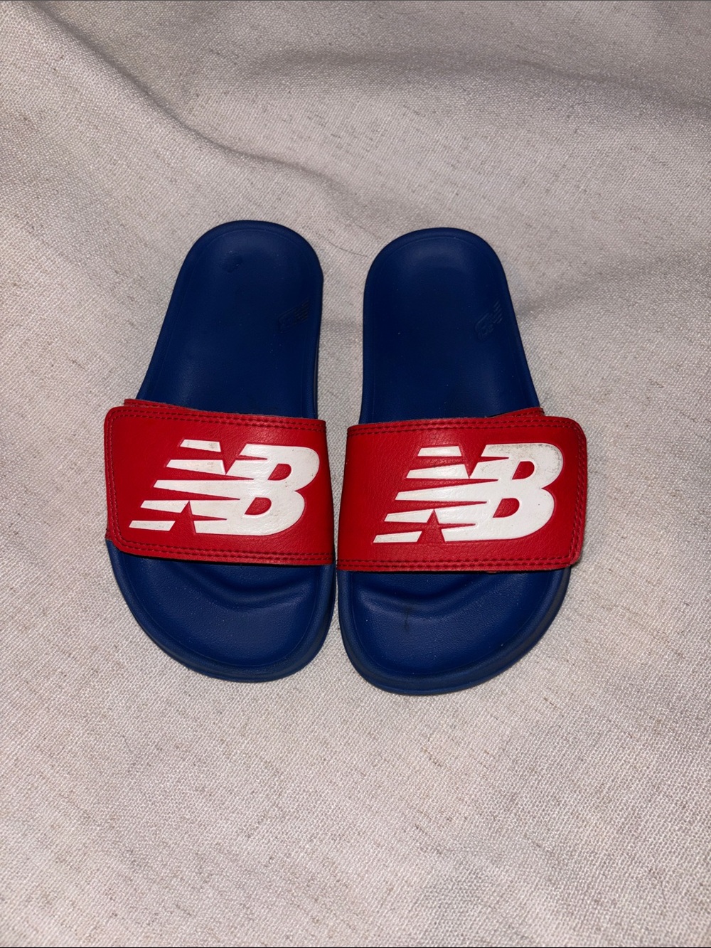 New Balance Kids Blue Slide Sandals with Red Strap